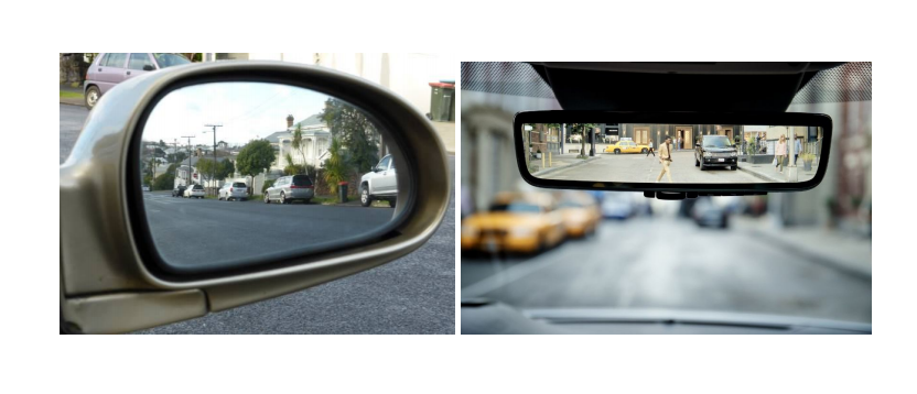 A car's side-view mirror and rear-view mirror showing the reflection of traffic.
